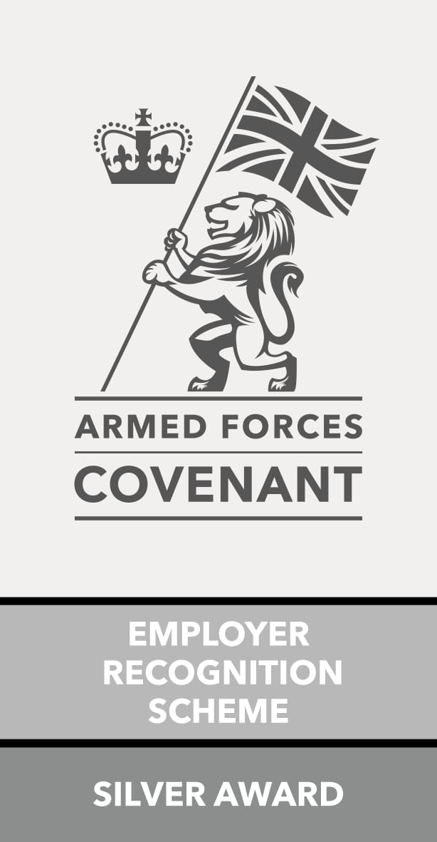 Grey and white Armed Forces Covenant Employer Recognition Scheme Silver Award logo. The design shows a crowned lion holding a Union Jack flag above the words “Armed Forces Covenant.” Below, bold text reads “Employer Recognition Scheme” and “Silver Award.”